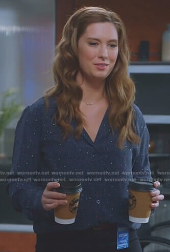 Katie's navy printed shirt on Great News