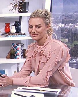 Morgan's pink ruffled tie neck blouse on E! News Daily Pop