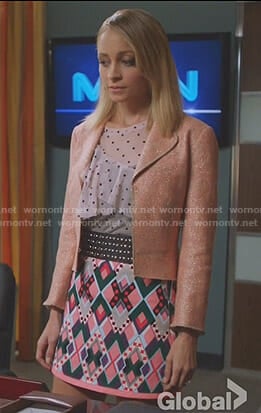 Portia's white dotted ruffled top and pink printed mini skirt on Great News
