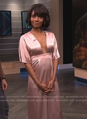 Zuri's pink satin jumpsuit on E! News