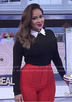 Adrienne's black scalloped collar top and red pants on The Real