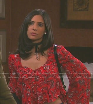 Gabi's red printed v-neck top on Days of our Lives
