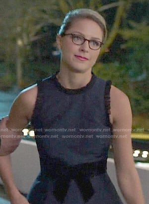 Kara's navy dress with ruffle trim on Supergirl