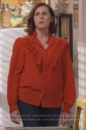 Val's red ruffle front top on Will and Grace