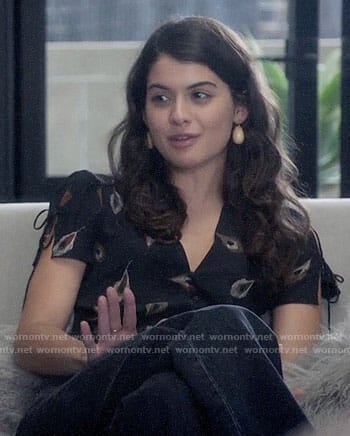 Sabrina's black feather print top on The Mick
