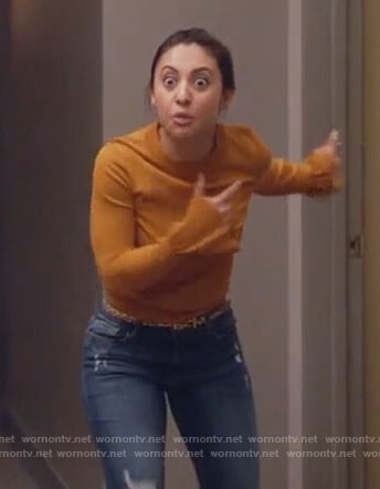 Ana's yellow flare cuff sweater on Grown-ish