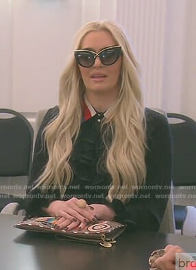 Erika's black ruffled blouse on The Real Housewives of Beverly Hills