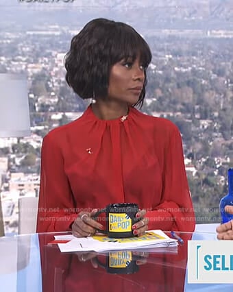 Zuri's red pleated neck blouse on E! News Daily Pop