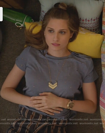 Nomi's distressed tee and gold arrow necklace on Grown-ish