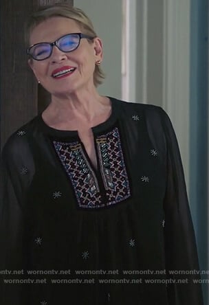Joan's black v-neck embroidered top on Life in Pieces