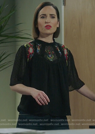 Jen's black short sleeve embroidered top on Life in Pieces