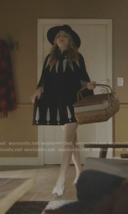 Fallon's black feather embroidered cape on Dynasty