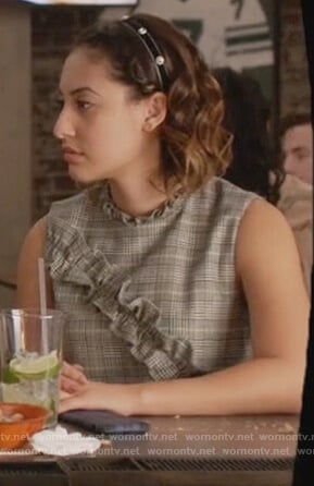 Ana's plaid ruffled top on Grown-ish