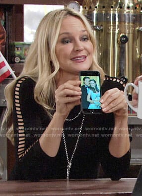 Sharon's black ladder-sleeve top on The Young and the Restless