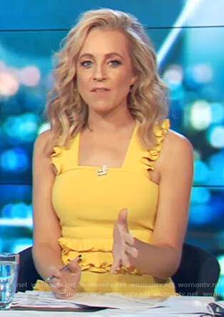 Carrie's yellow ruffled top on The Project