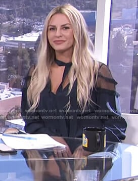 Morgan's navy tie neck blouse with mesh shoulders on E! News Daily Pop