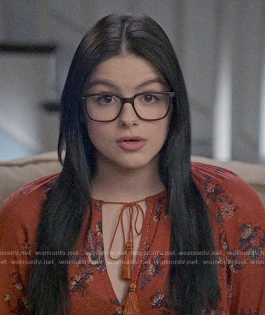Alex's orange floral top on Modern Family