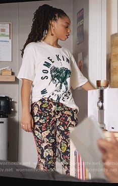 Jazlyn's dinosaur tee and black animal print pants on Grown-ish