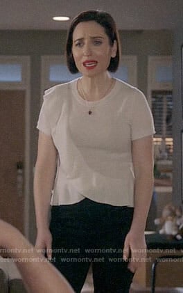 Jen's white ruffled short sleeve sweater on Life in Pieces