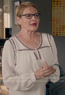 Joan's white embroidered blouse on Life in Pieces