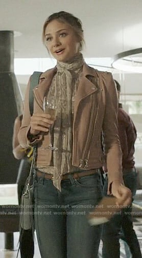 Megan's pink leather jacket and blue crossbody bag on The Arrangement