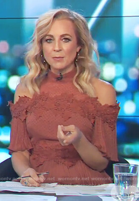 Carrie's red cold shoulder ruffle dress on The Project