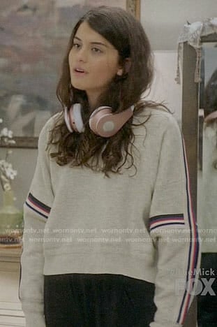 Sabrina's sweater with striped sleeves on The Mick