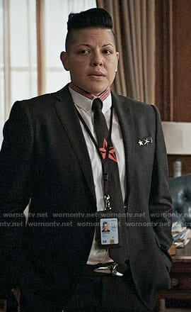 Kat's black and red star tie and shirt on Madam Secretary