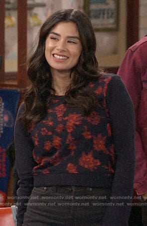 Sofia's navy sweatshirt with floral front on Superior Donuts