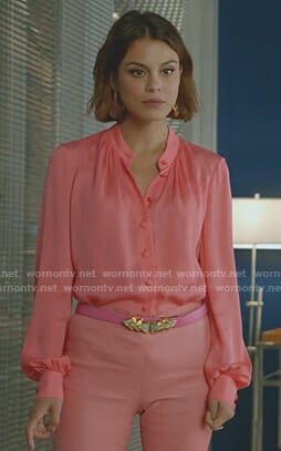 Cristal's pink blouse and gold statement earrings on Dynasty