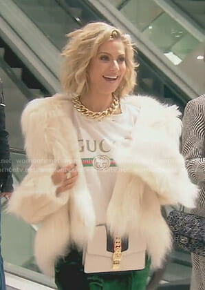 Dorit's white Gucci t-shirt and fur coat on The Real Housewives of Beverly Hills
