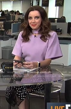 Melanie's purple cutout top and black polka dot skirt on Live from E!