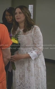 Quinn's white long sleeve lace dress on Scandal