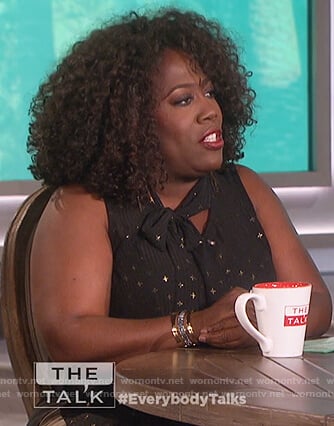 Sheryl's black tie neck sleeveless top on The Talk