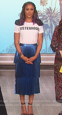 Eve's white sisterhood t-shirt and pleated blue skirt on The Talk