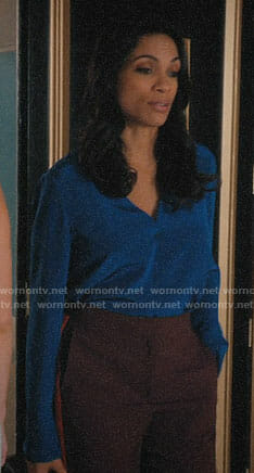 JR's blue blouse and burgundy pants on Jane the Virgin