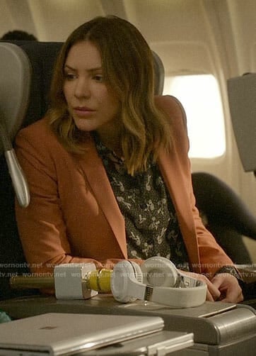 Paige's floral blouse and coral blazer on Scorpion