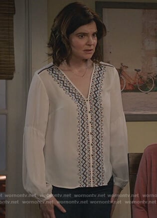 Heather's white v-neck embroidered top on Life in Pieces