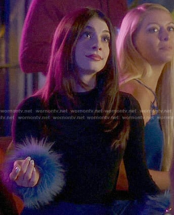 Alexis's black top with blue feather cuffs on Famous In Love