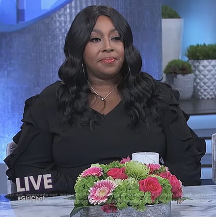 Loni's black ruffle sleeve jumpsuit on The Real