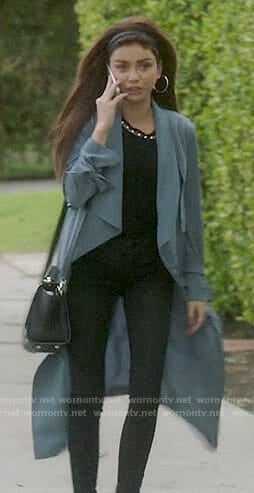 Haley's black pearl embellished top and blue coat on Modern Family