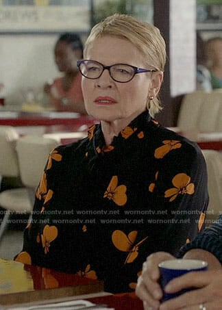 Joan's black and orange floral dress on Life in Pieces
