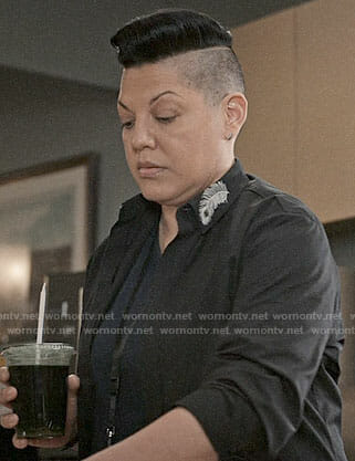 Kat's black shirt with peacock feather collar on Madam Secretary