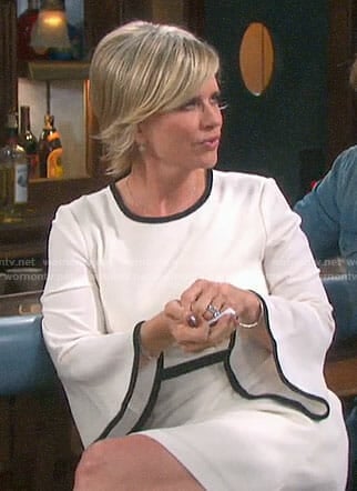 Kayla's white bell-sleeve dress with black trim on Days of our Lives
