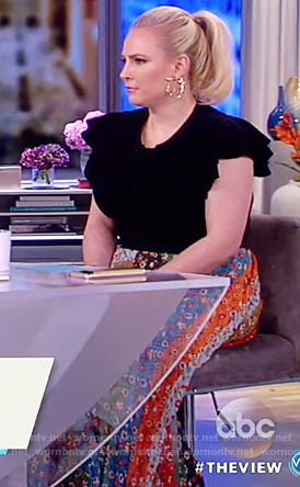 Meghan's black ruffle sleeve top and floral print maxi skirt on The View
