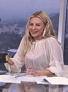 Morgan's white dotted tie neck top on E! News Daily Pop