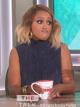 Eve's navy smocked high neck top on The Talk