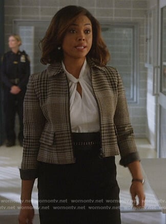 Jasmine's white twisted blouse and plaid jacket on Instinct