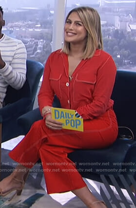 Carissa's red shirt with white stitching and cropped pants on E! News Daily Pop