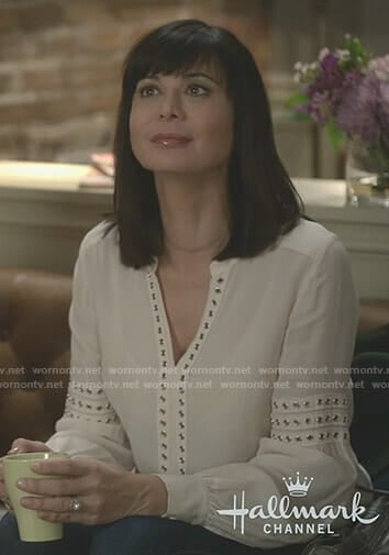 Cassie's white grommet trim blouse on Good Witch